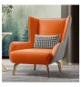 Кресло комбинированое из серой и оранжевой кожи с золотистыми ножками